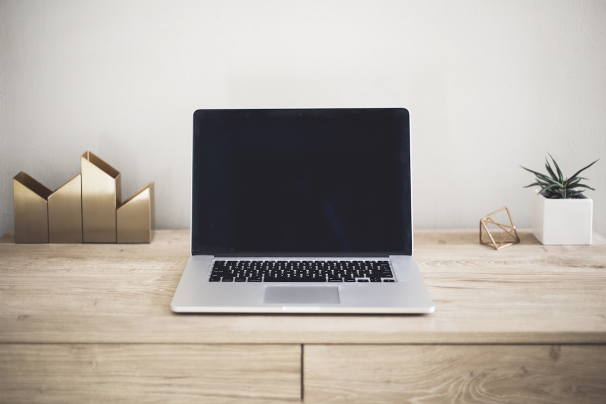 laptop AI tools writing resume technology professional - use ai to improve your resume without sounding