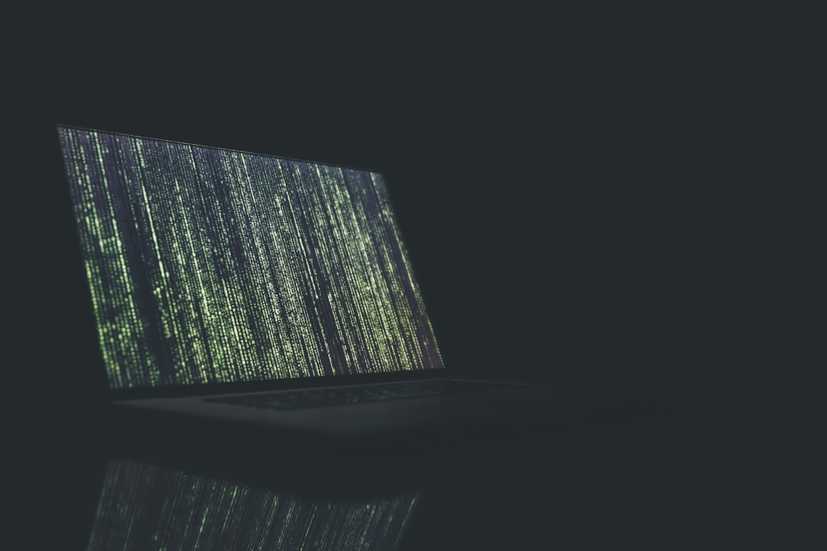 Cybersecurity analyst working at multiple monitors analyzing network security - cybersecurity resume that proves your skills