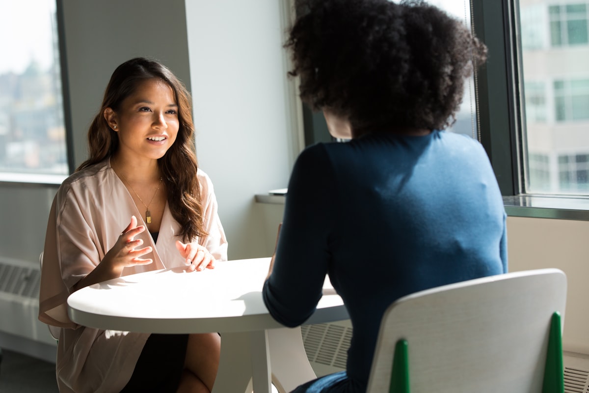 Professional politely declining job offer over phone while writing notes - decline a job offer gracefully without burning bridges
