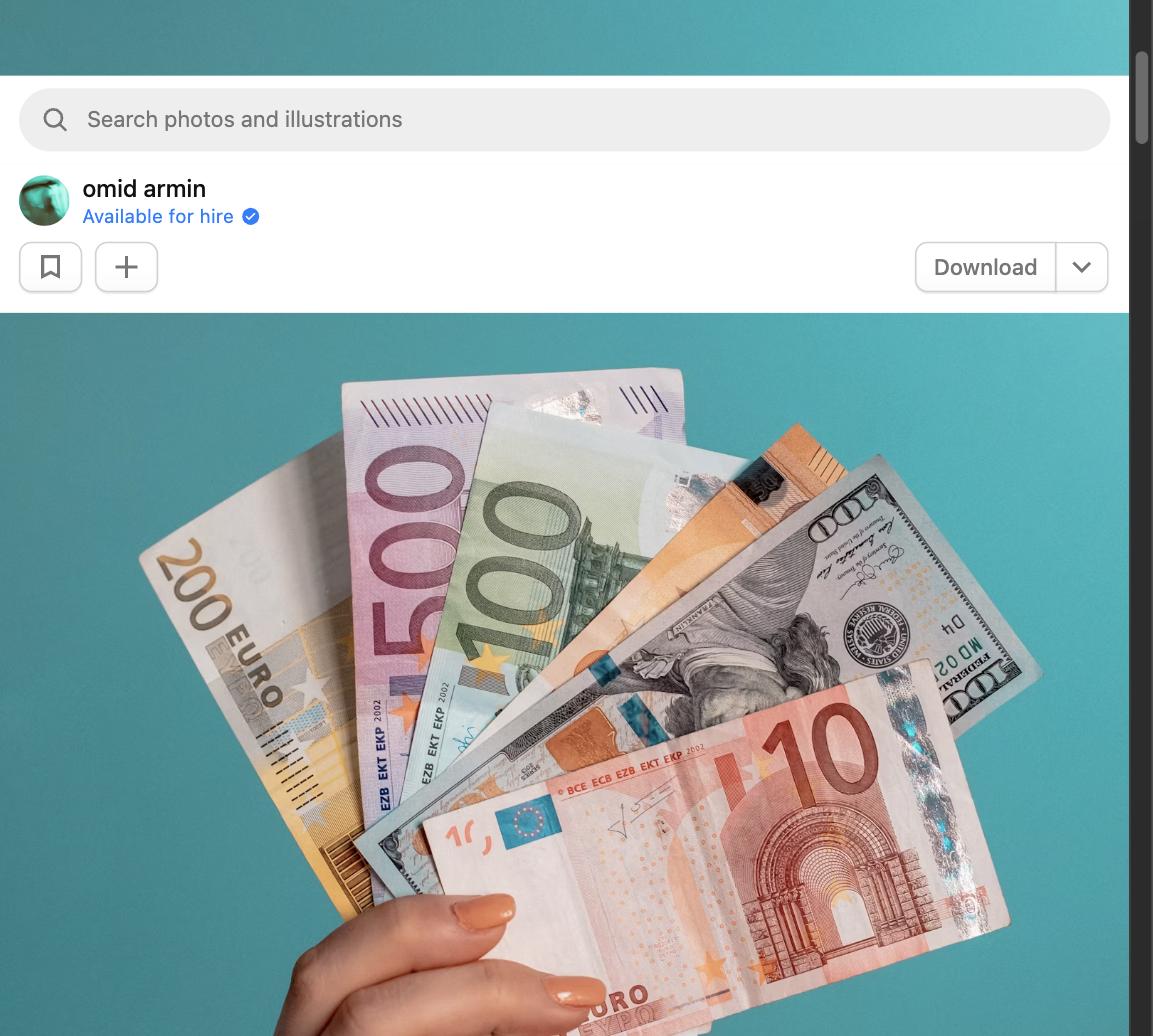 Hand holding a fan of euro and dollar bank notes