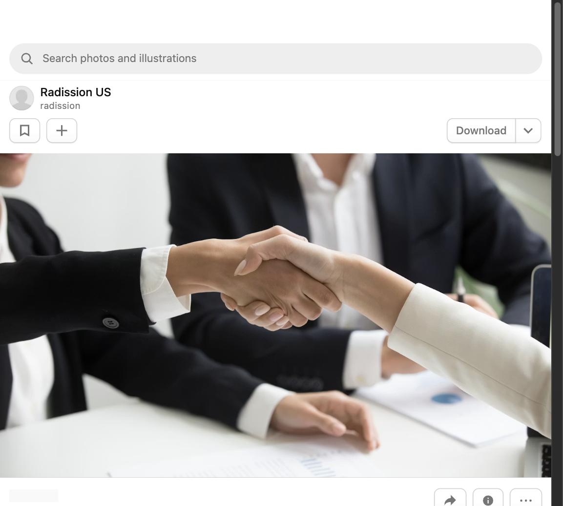 Two people shaking hands during a salary negotiation meeting