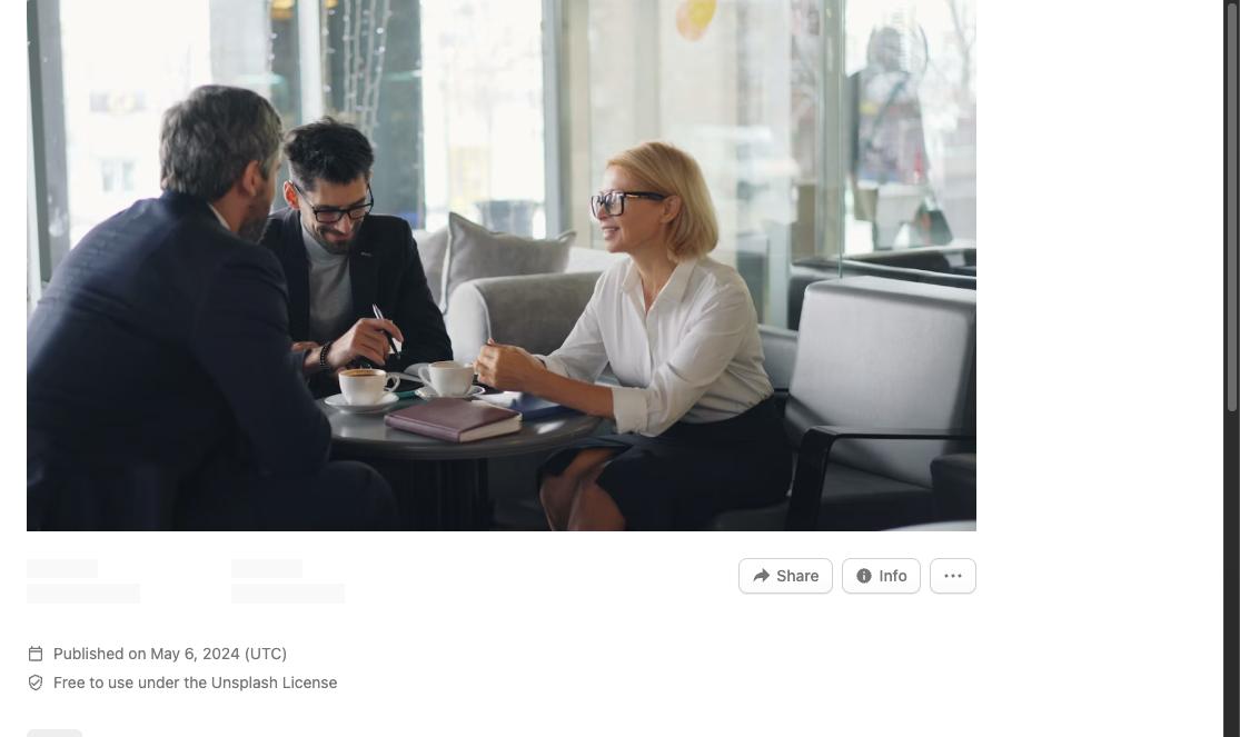 Two men and a woman having an informal conversation at a coffee table