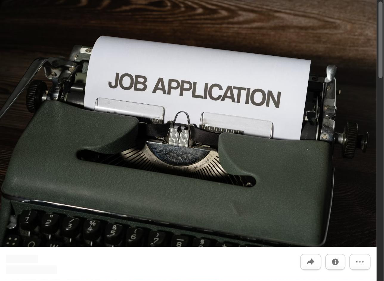 A vintage typewriter with a page reading Job Application, representing writing a job application that gets noticed