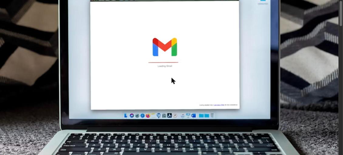 Laptop showing Gmail loading screen for sending a cold email