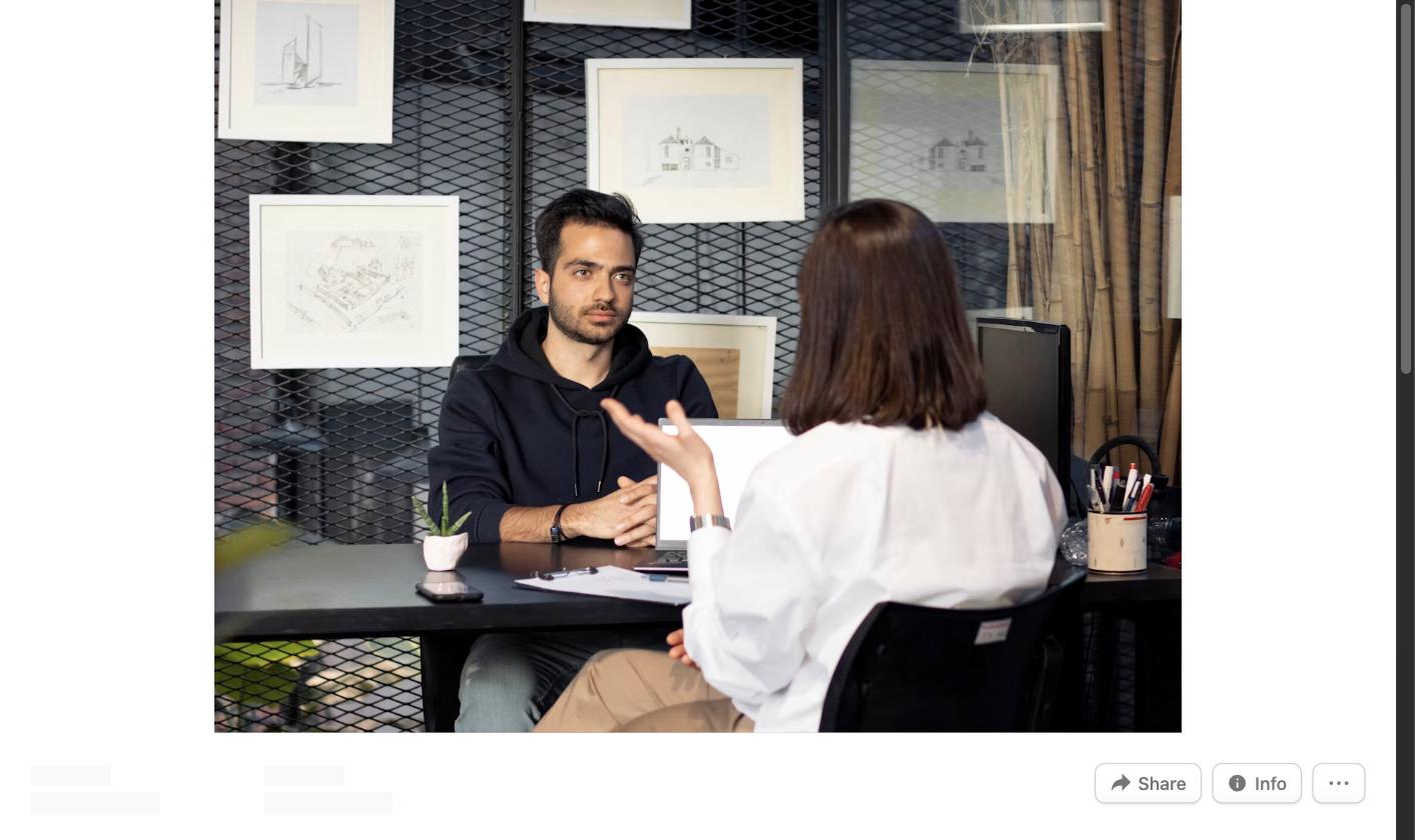 Man and woman conducting a mock interview at a desk
