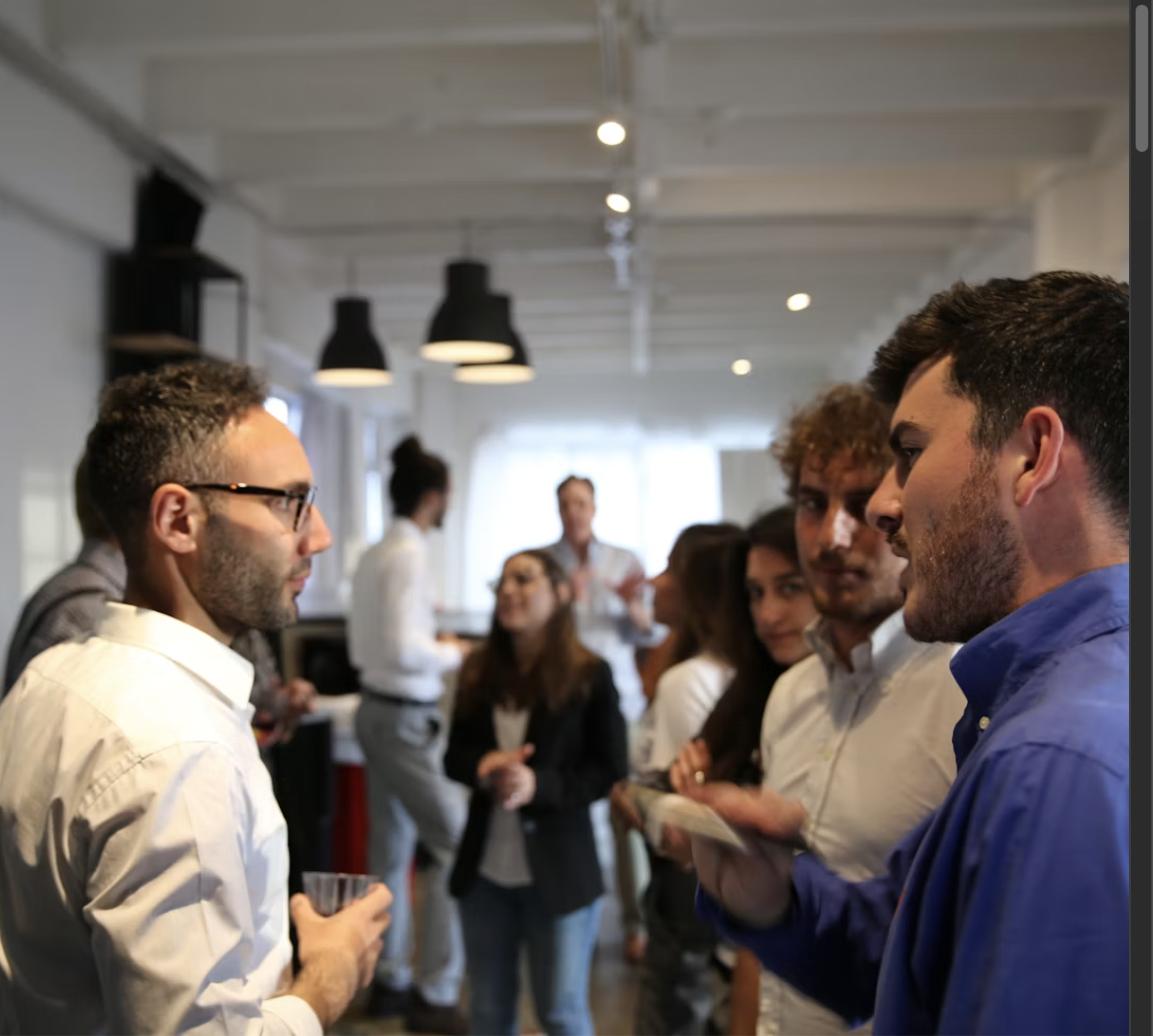 People networking and talking at a professional event