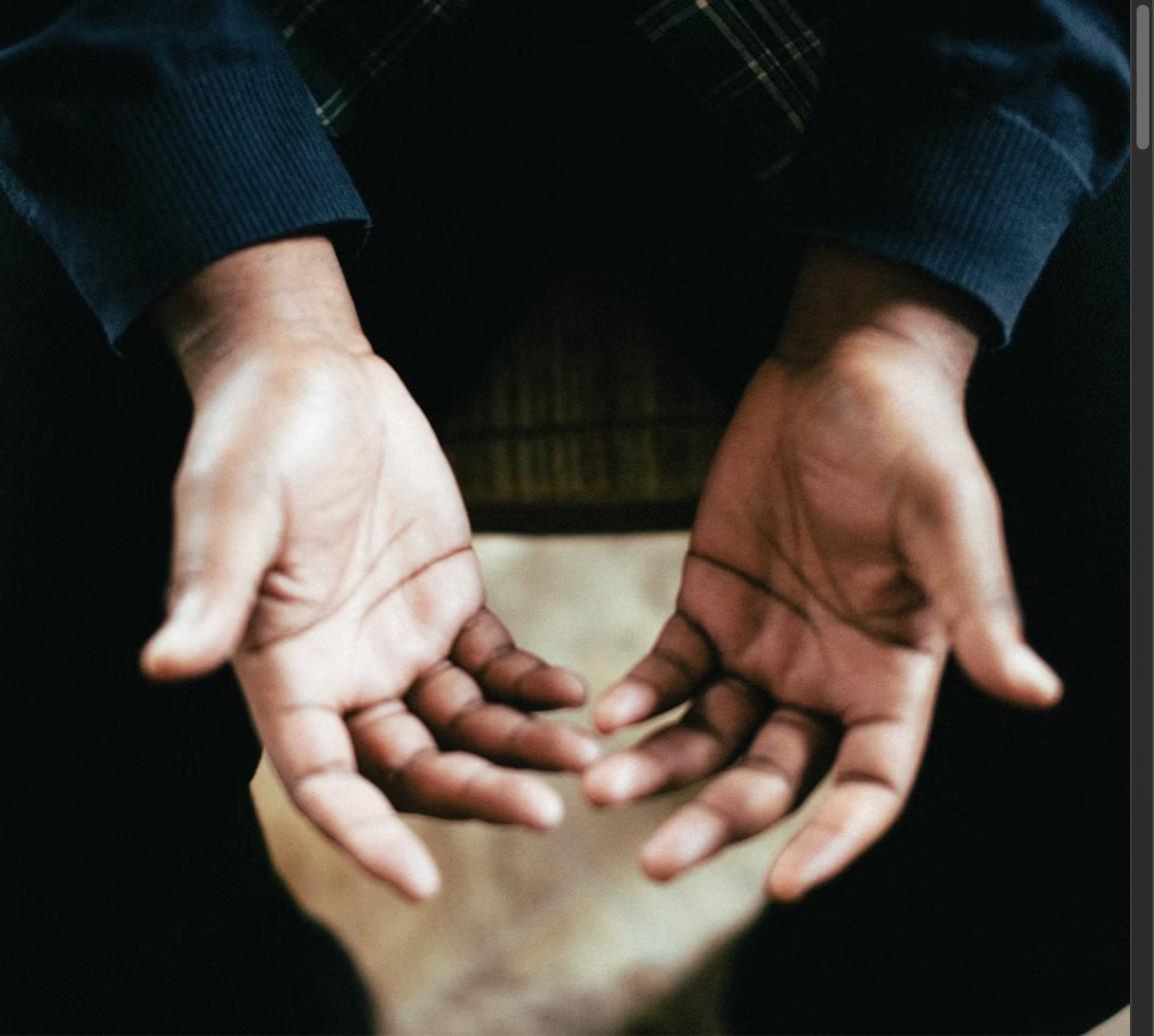 Open hands gesture, representing a thoughtful and composed response under pressure