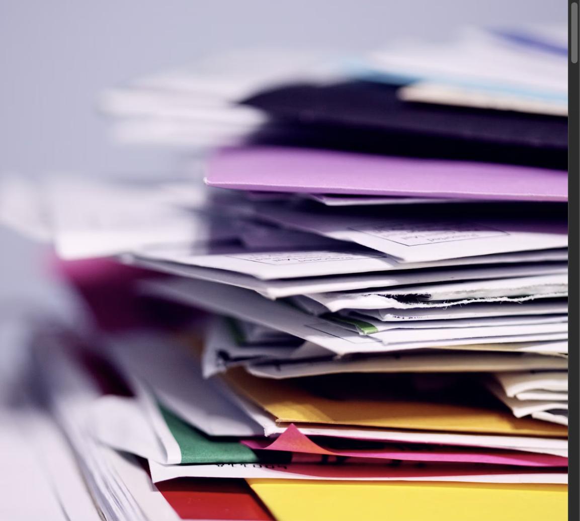Colorful stack of documents and papers representing different cover letter examples