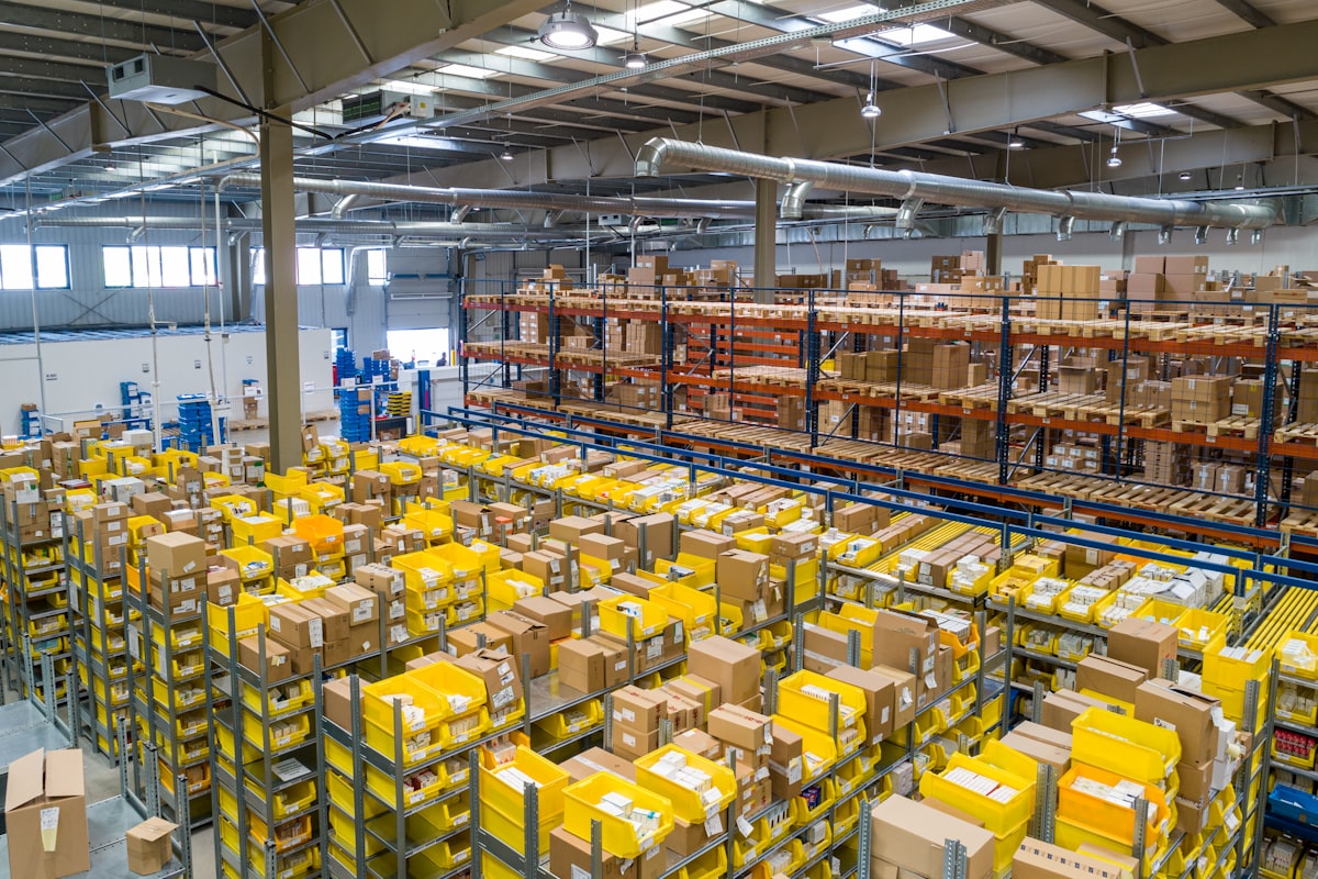 Supply chain manager reviewing warehouse logistics and inventory - supply chain resume that shows real impact