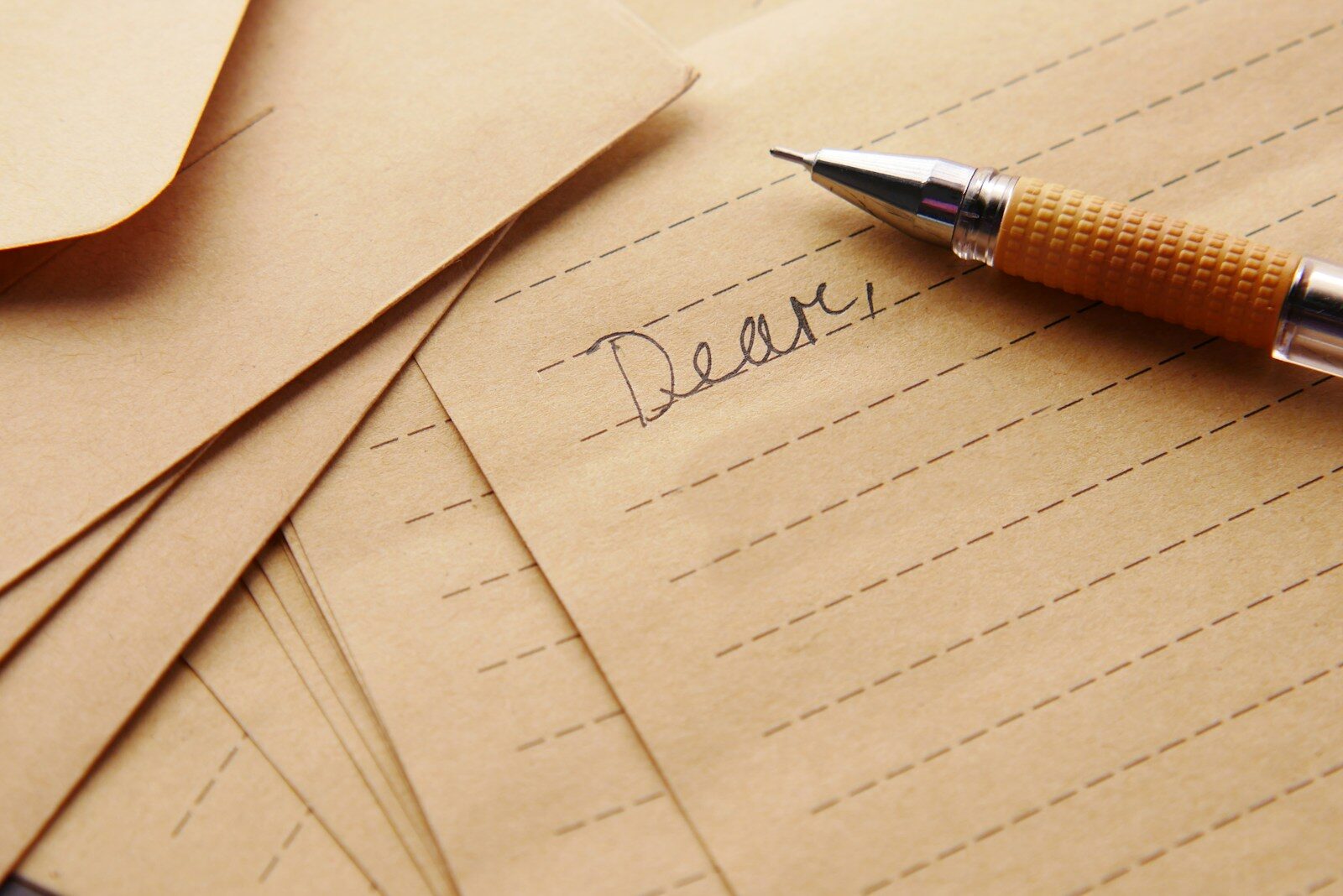 a pen sitting on top of a piece of paper - two weeks notice letter
