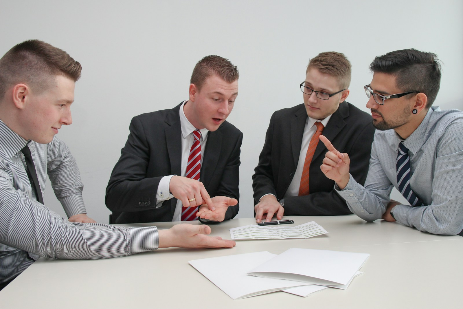 Workplace conflict discussion between coworkers at a desk