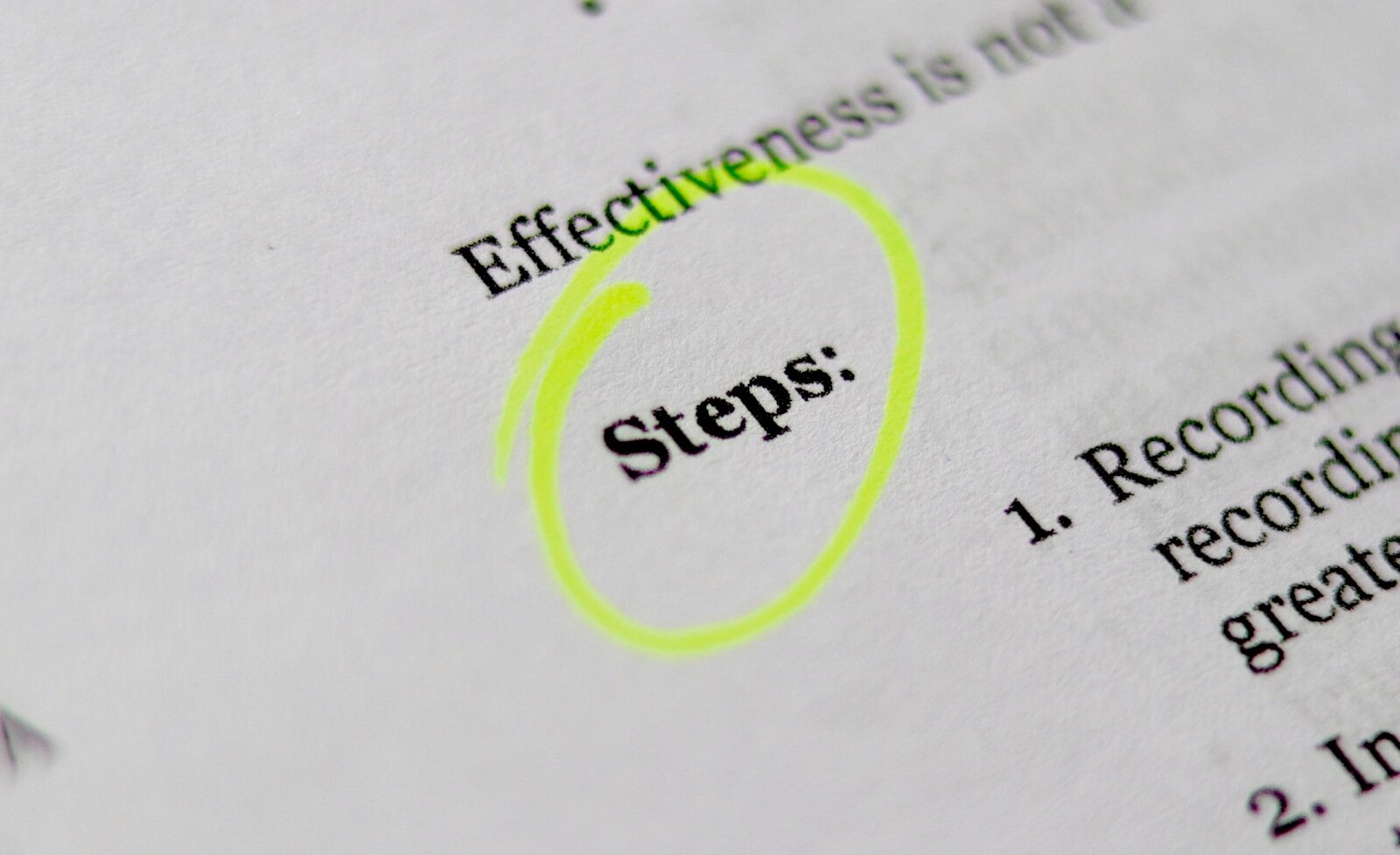 Document with 'Steps' circled in highlighter, representing a checklist for writing an ATS-friendly resume