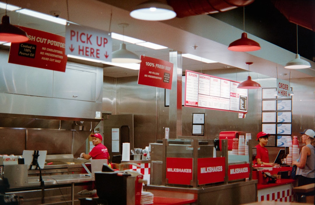 Employees working behind the counter at a fast casual restaurant