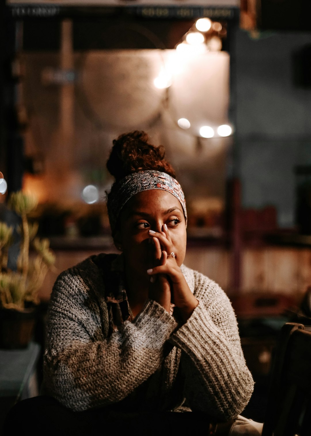 Person calmly reflecting, representing a steady approach to job searching after a layoff