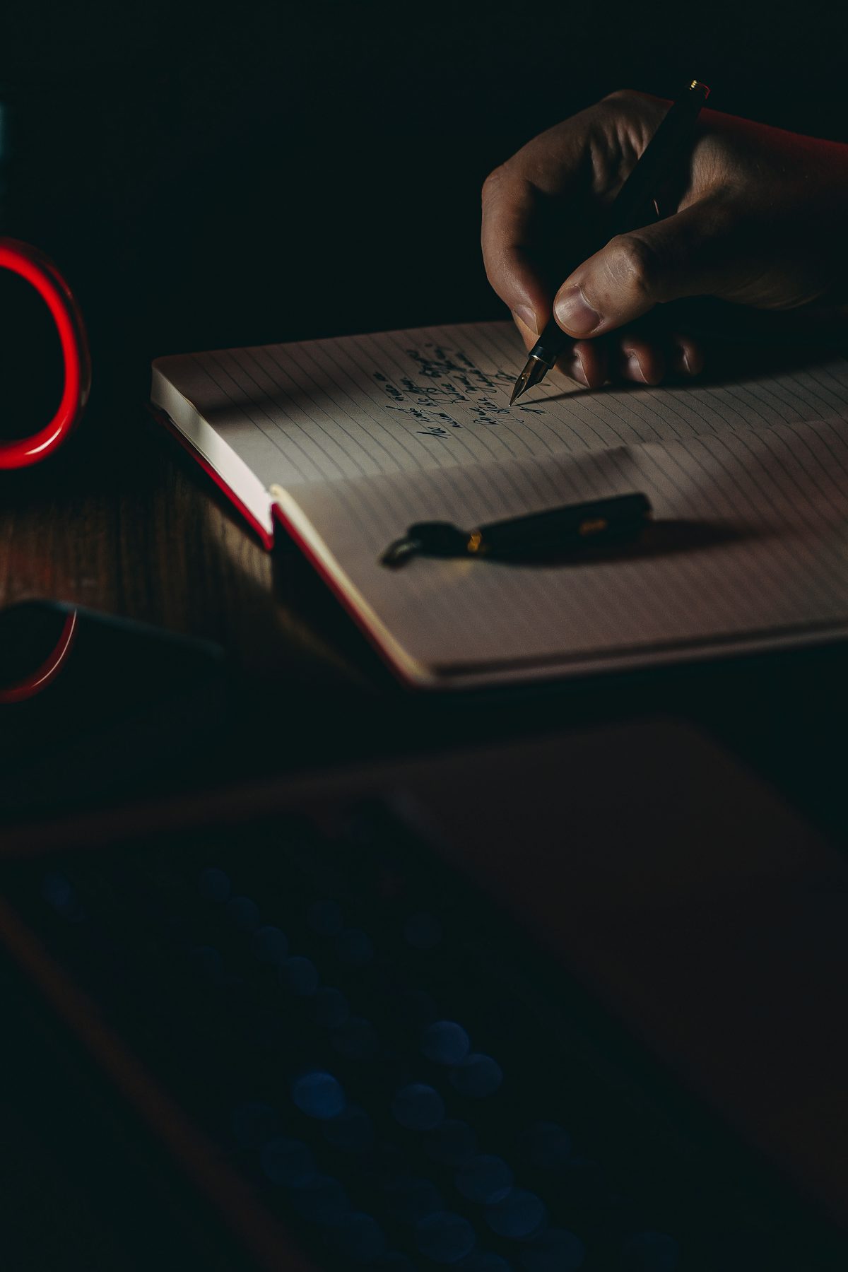Person planning a job search strategy in a notebook