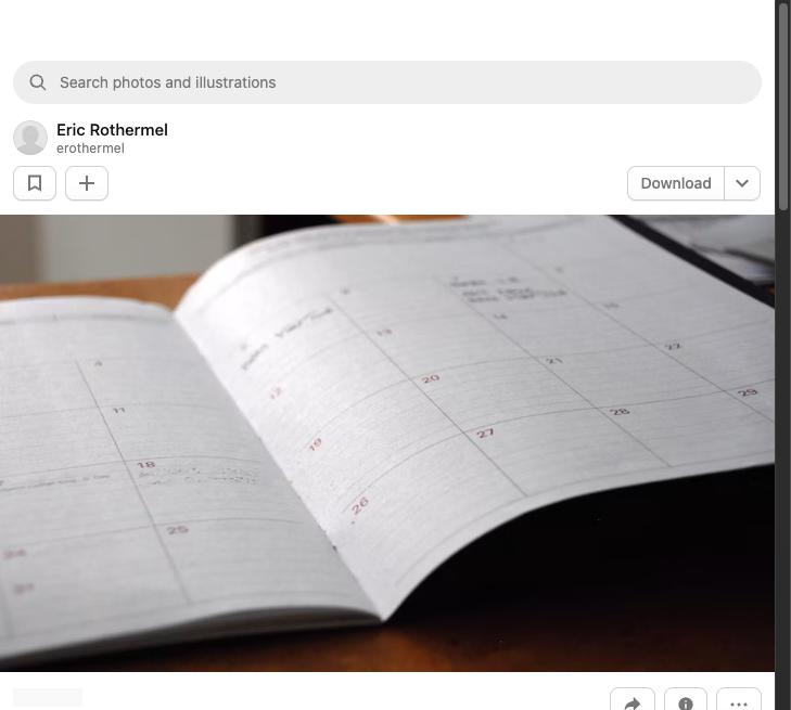 Open monthly planner on a wooden desk for a 30-day plan