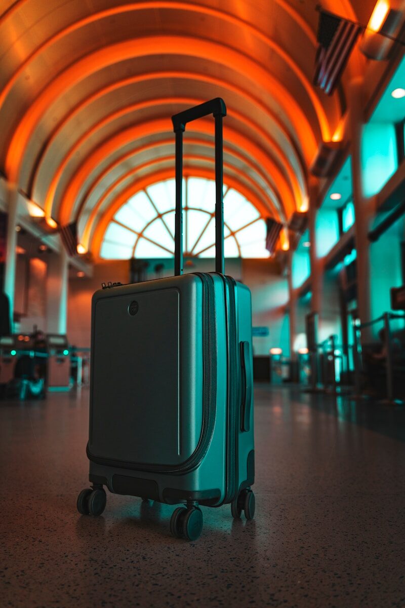 Suitcase in an airport terminal, representing building a career while relocating to a new country