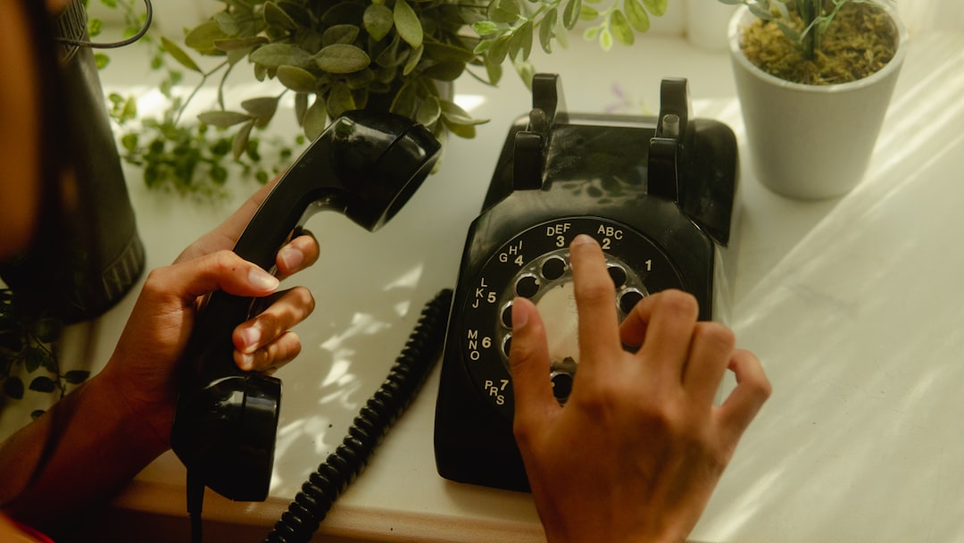 Person holding a phone, waiting for a call back after a job interview