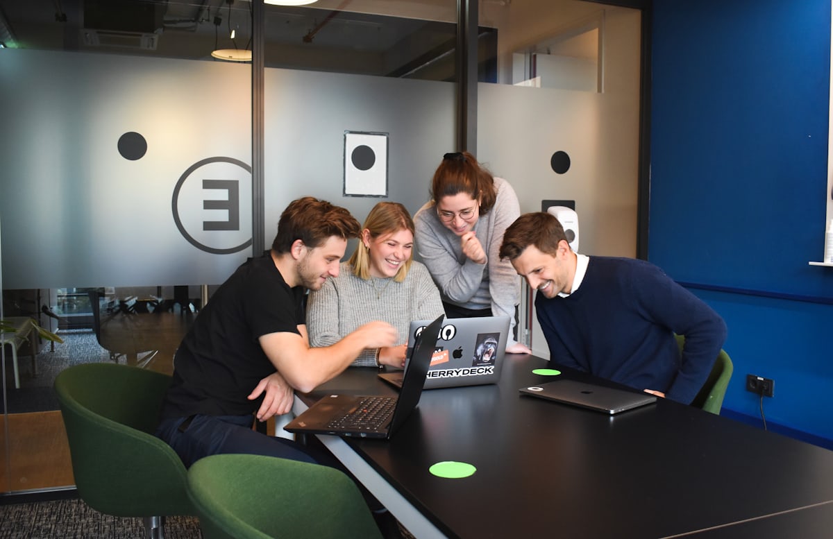 Group of professionals in a team meeting, representing panel or group interviews