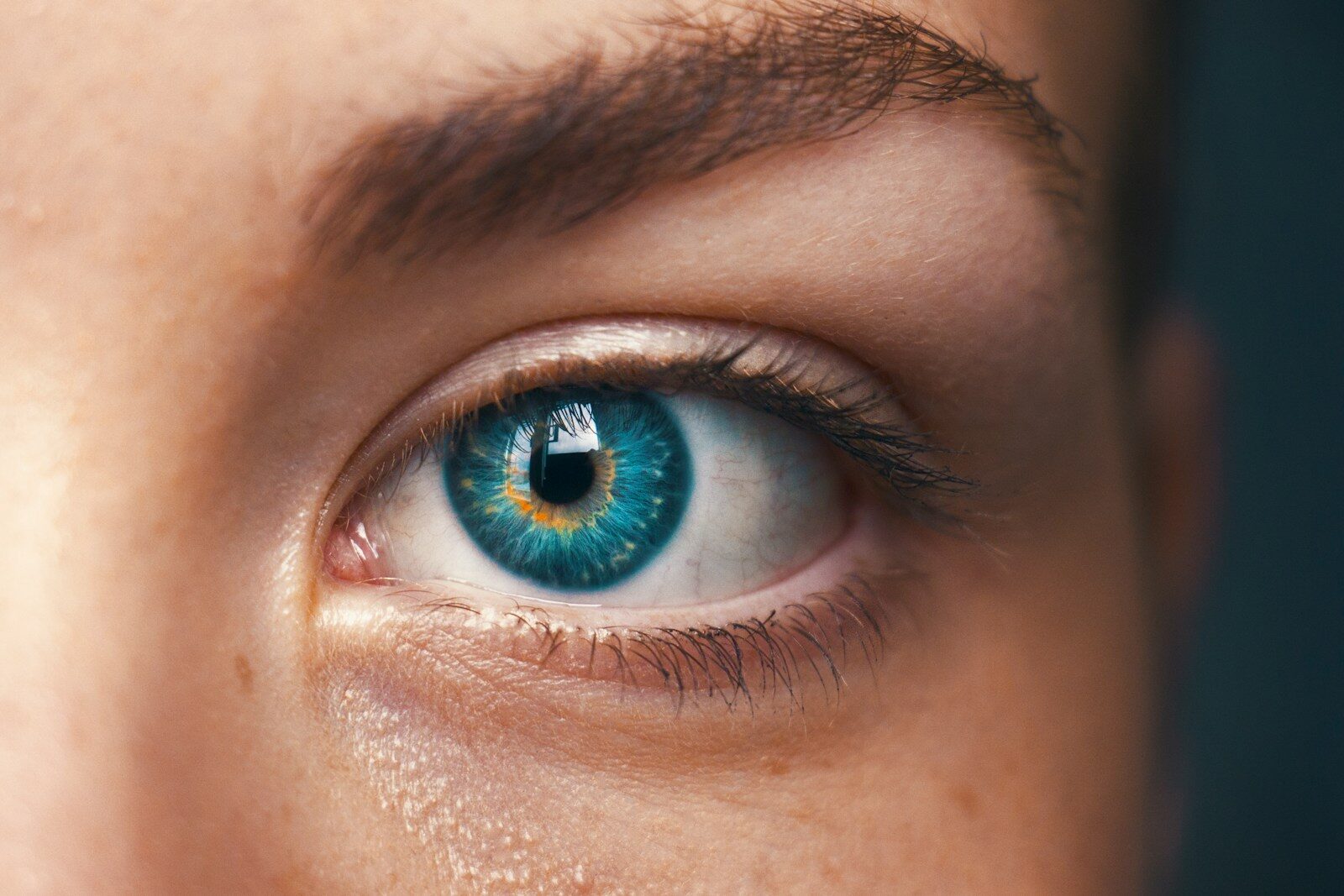 Close-up of a blue eye, representing attention-grabbing views on a LinkedIn headline