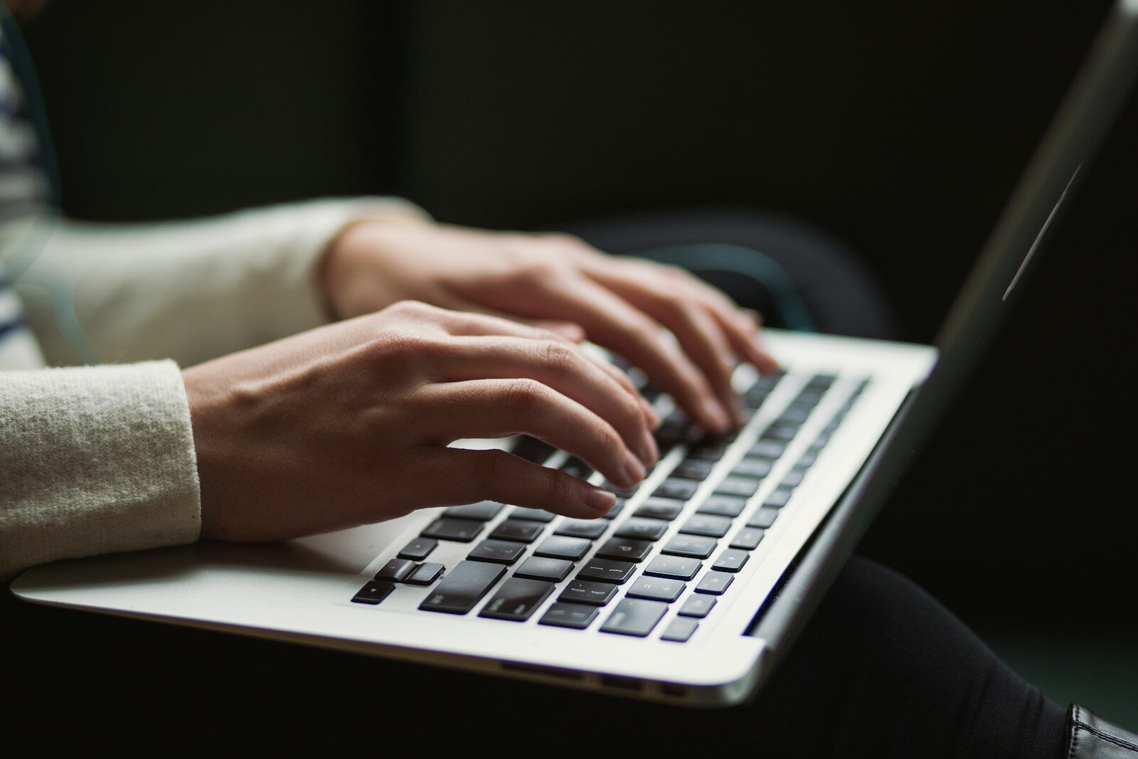 Person reviewing ghost jobs on a laptop while job searching