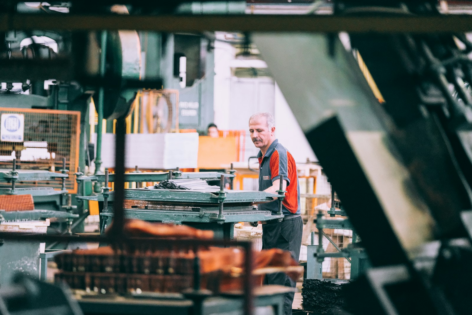 Six Sigma jobs: a technician performing a precision quality inspection in a manufacturing facility