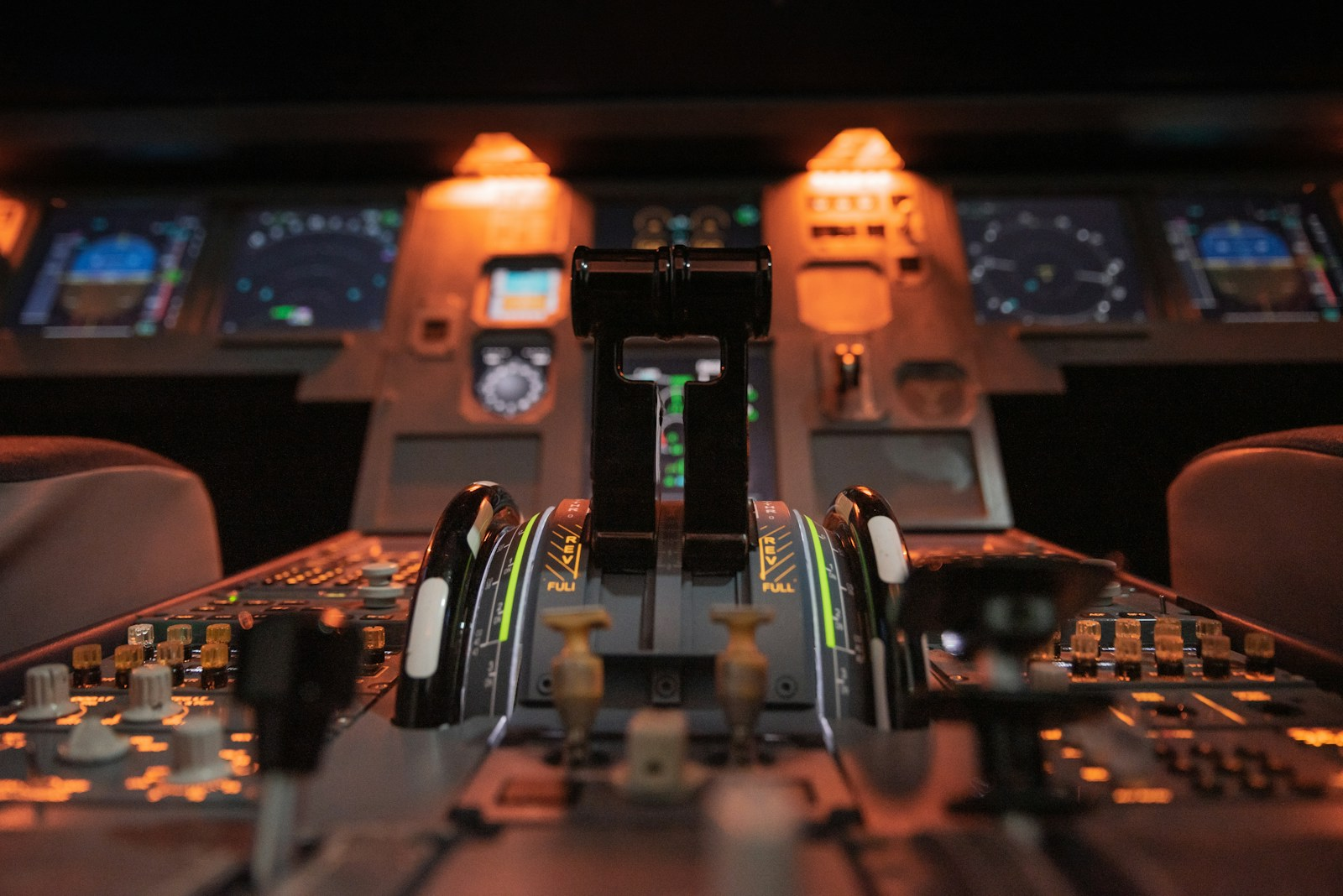 Become a pilot: an illuminated aircraft cockpit at dusk showing the instrument panel and flight controls, representing the flight deck pilots train for years to reach