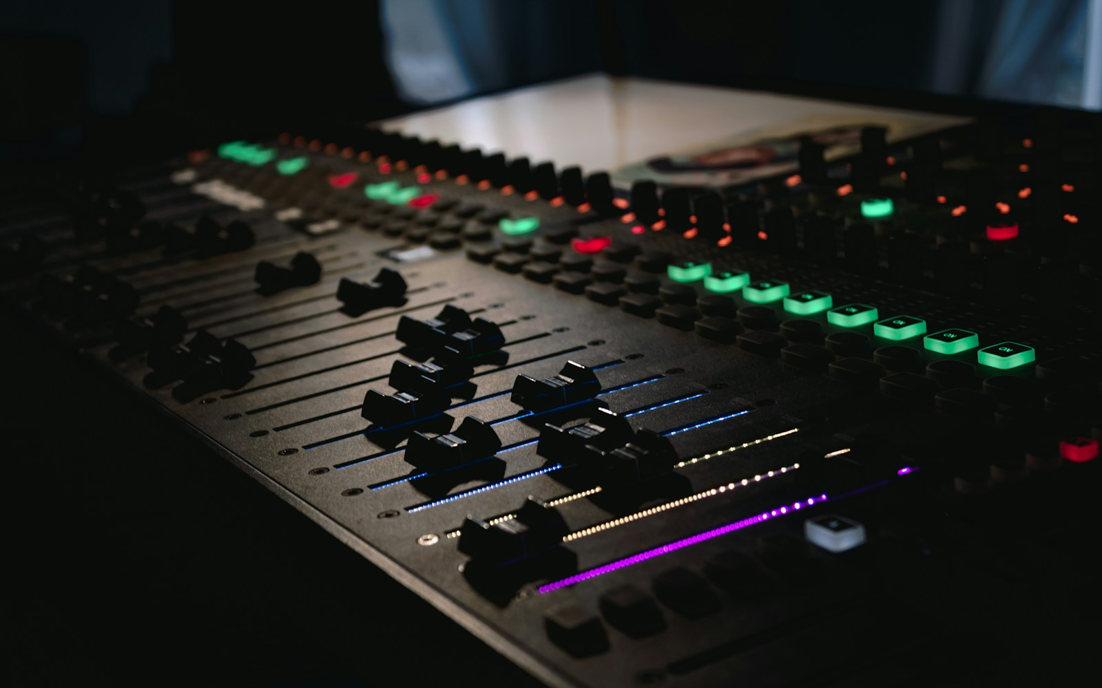 Careers in the music industry: a sound engineer mixing console in a recording studio