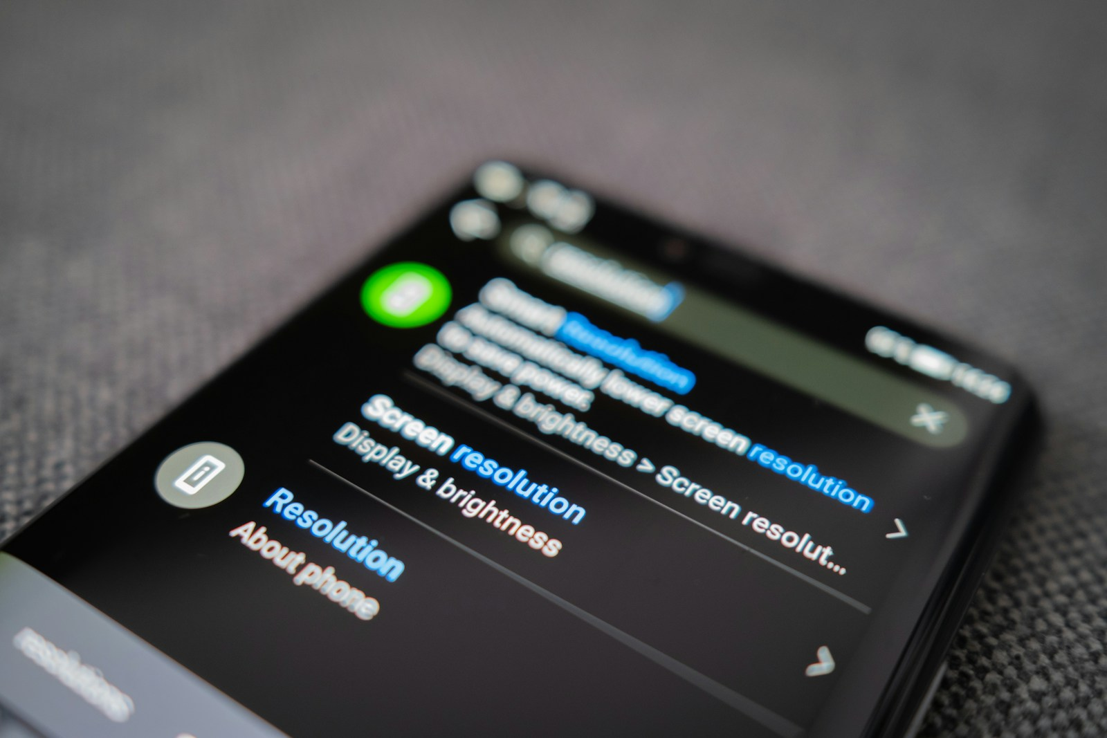 Time vampires: a close-up of a smartphone screen showing display and notification settings, symbolizing constant digital distraction