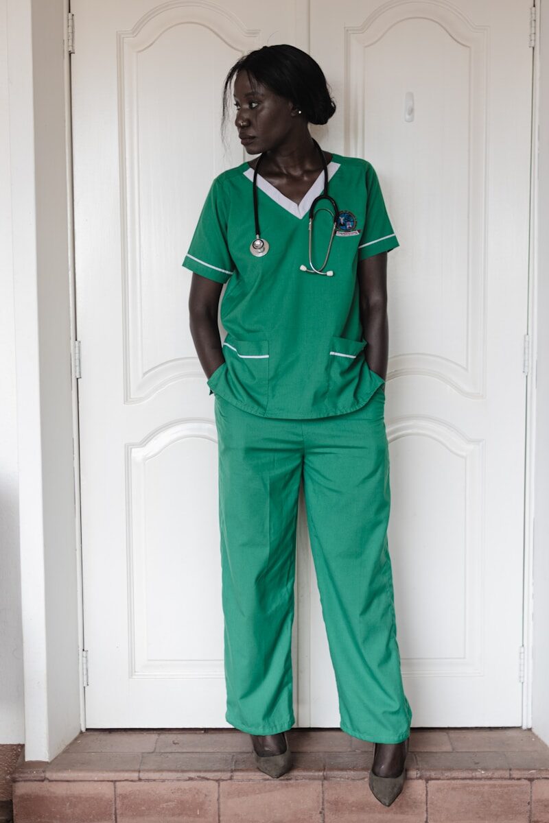 Become a nurse: a registered nurse in green scrubs with a stethoscope, representing the career people transition into after nursing school and licensure