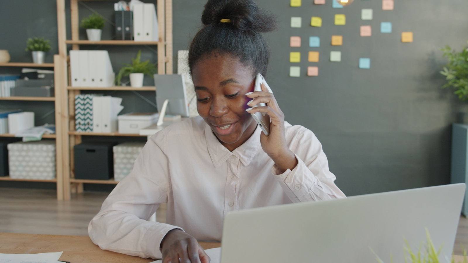 Woman on the phone, representing an employer calling references on your resume