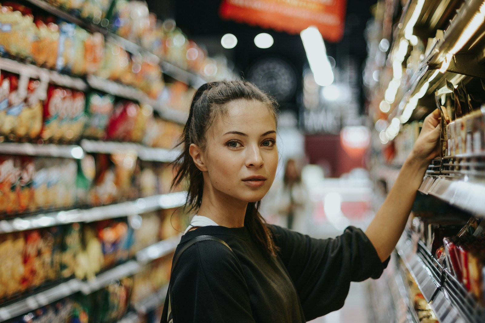 Retail store employee helping a customer during a secret shopping jobs evaluation visit