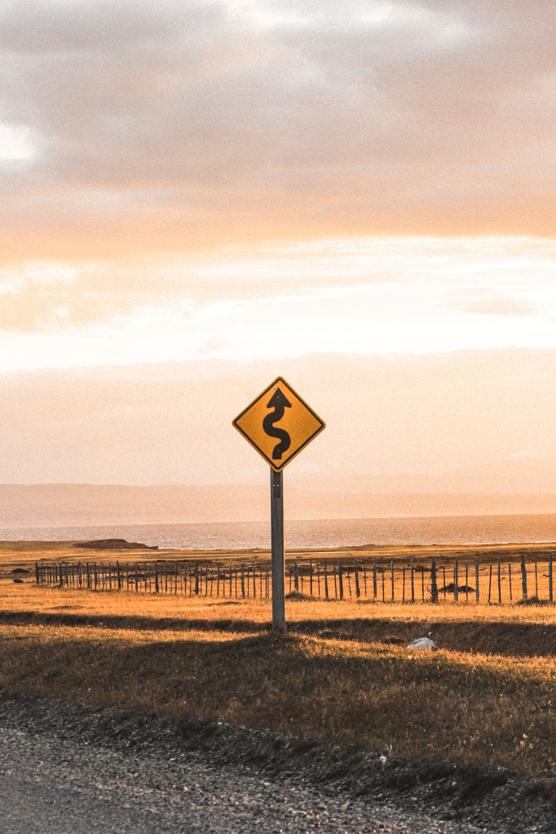 A winding road sign representing the twists of trying to find your ideal career path
