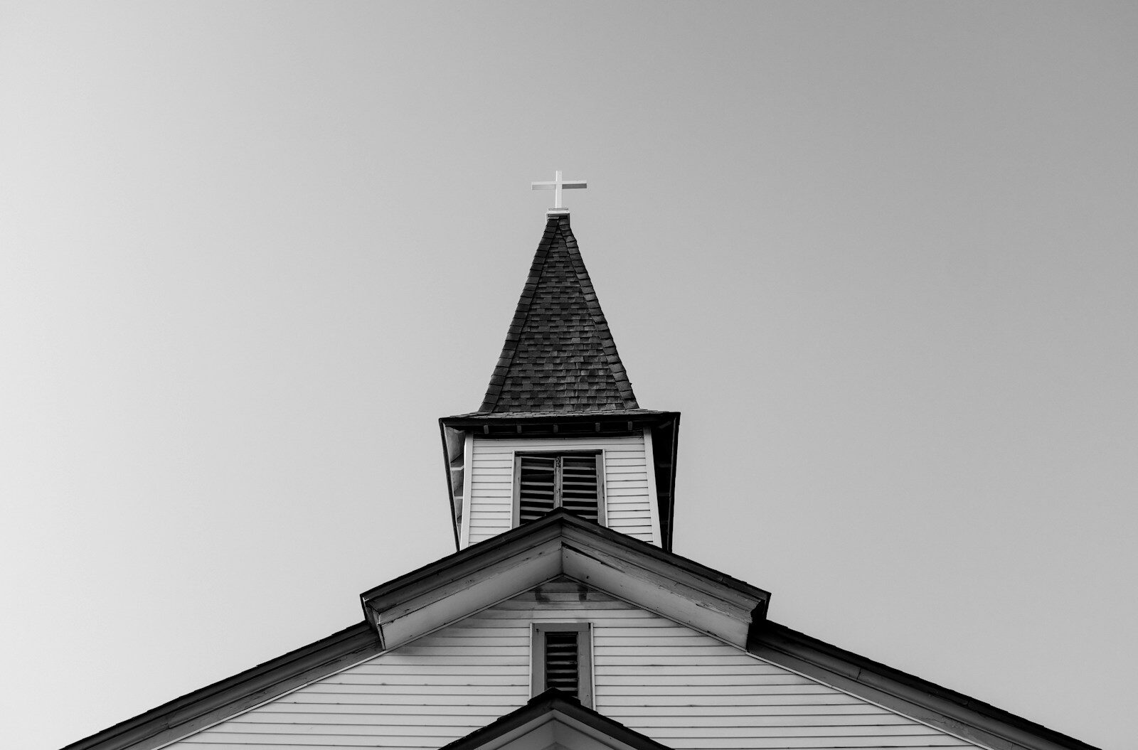 A tall church steeple against the sky, representing the kind of structure a steeplejack specializes in maintaining