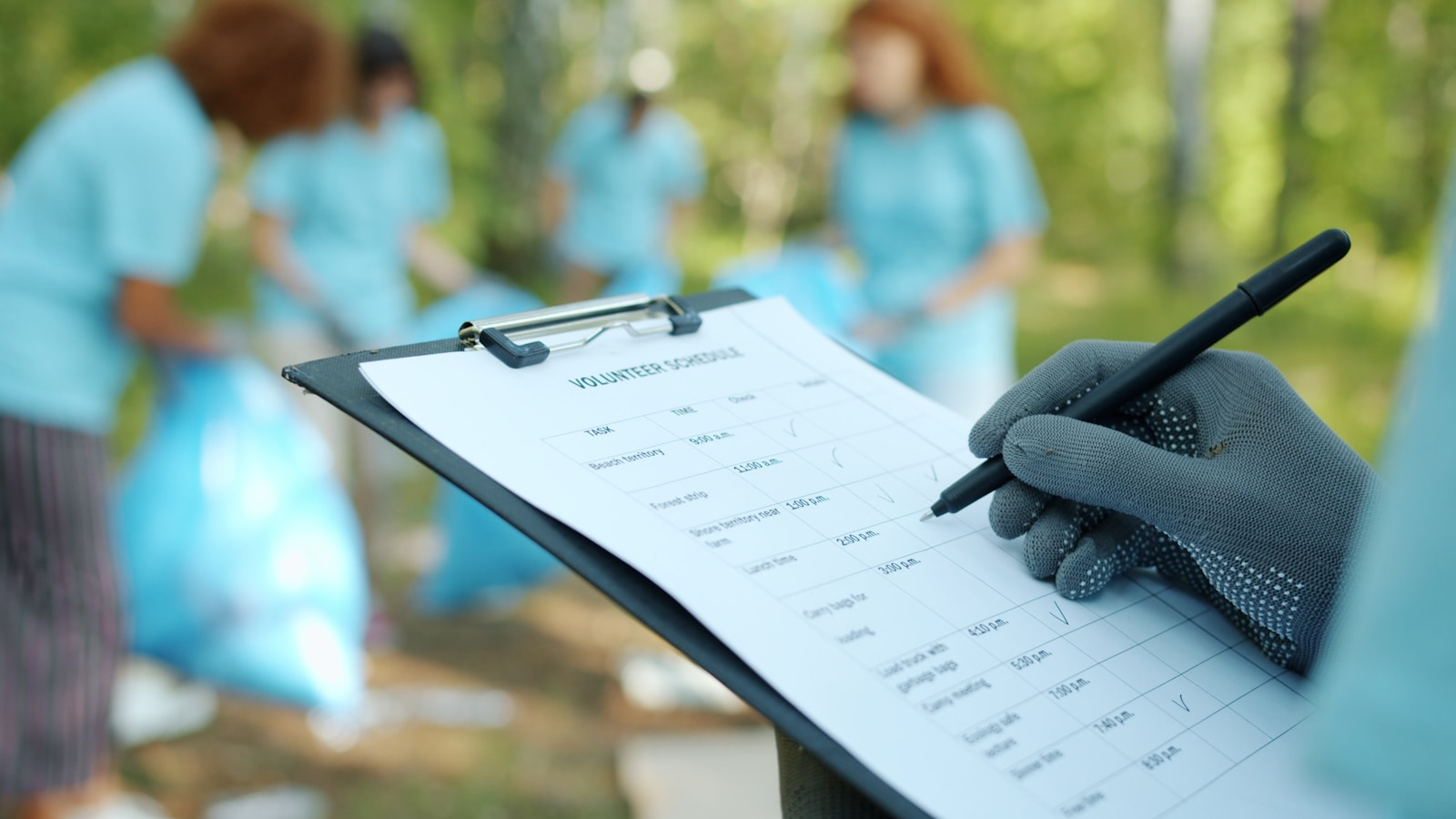 A nurse in scrubs reviewing paperwork, representing what online forensic nursing education programs prepare you for