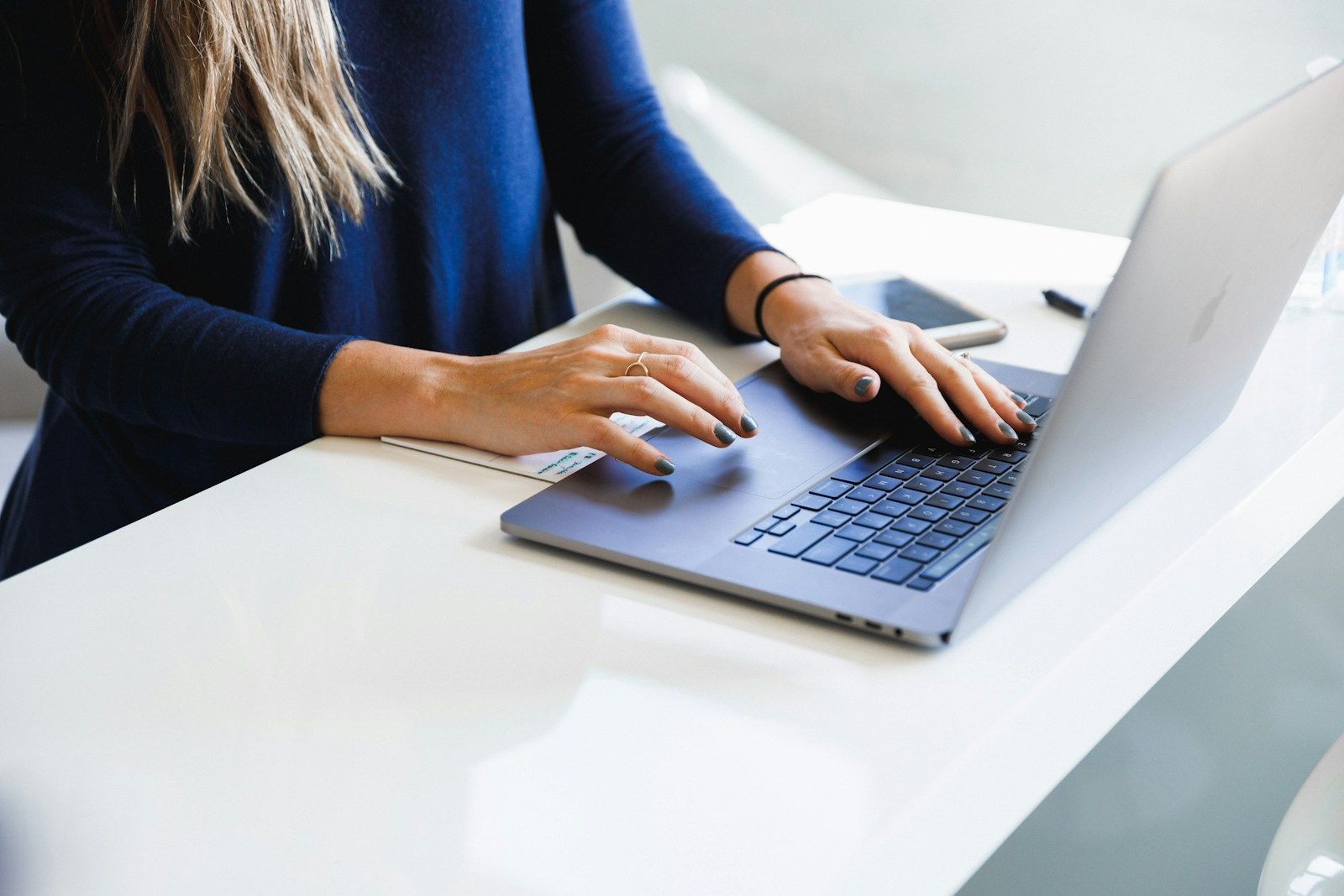 A job seeker updating their LinkedIn profile on a laptop, demonstrating the power of an online resume