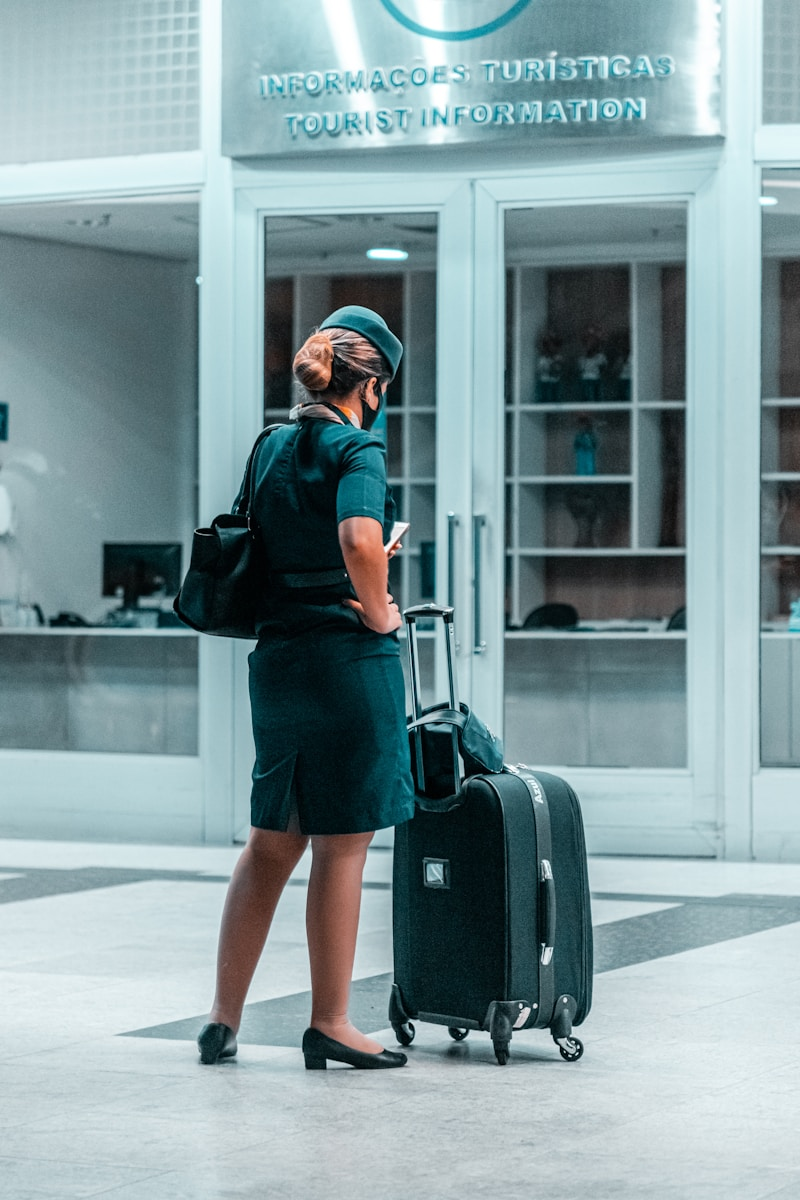 A travel nurse in scrubs pulling a suitcase, illustrating the pros and cons of travel nursing