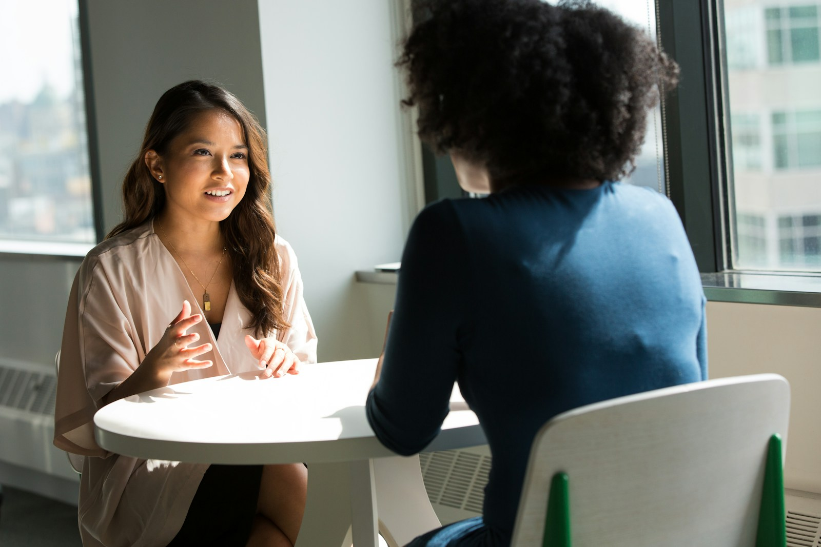 Two people practicing a mock interview, part of how to get ready for your next interview
