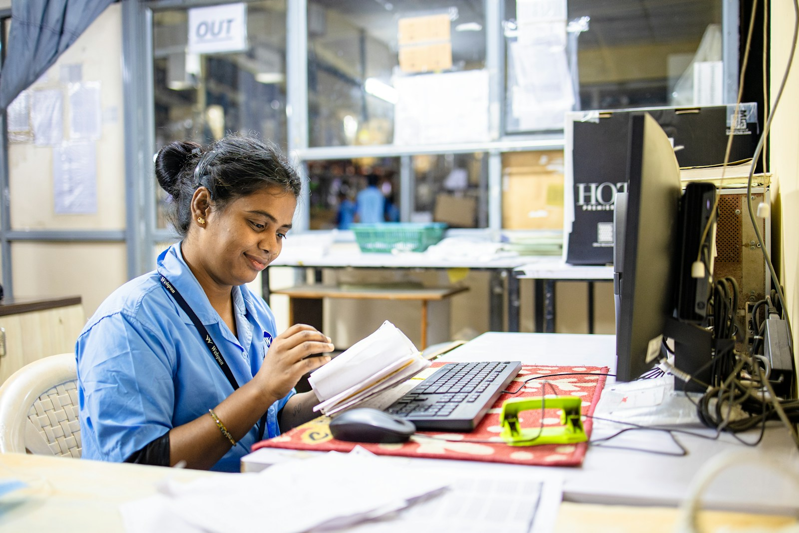 A nurse reviewing a contract and paperwork at a desk, weighing the pros and cons of travel nursing