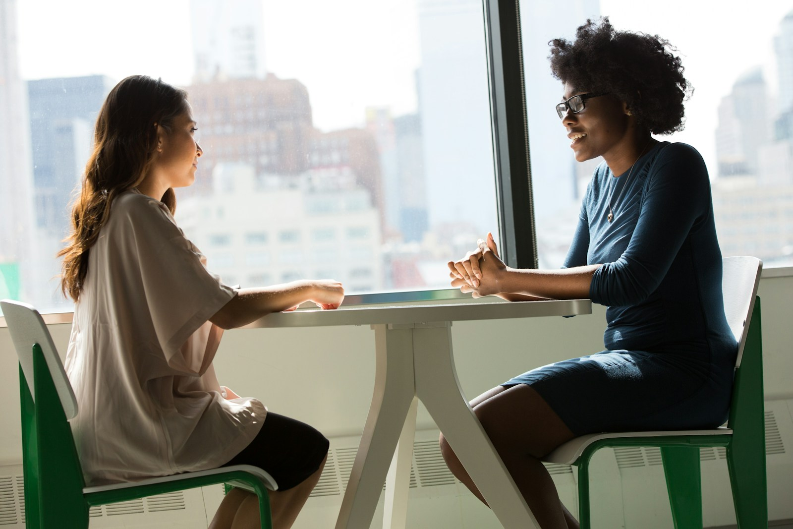 A therapist talking with a client in a counseling session, illustrating the practice of the therapy profession