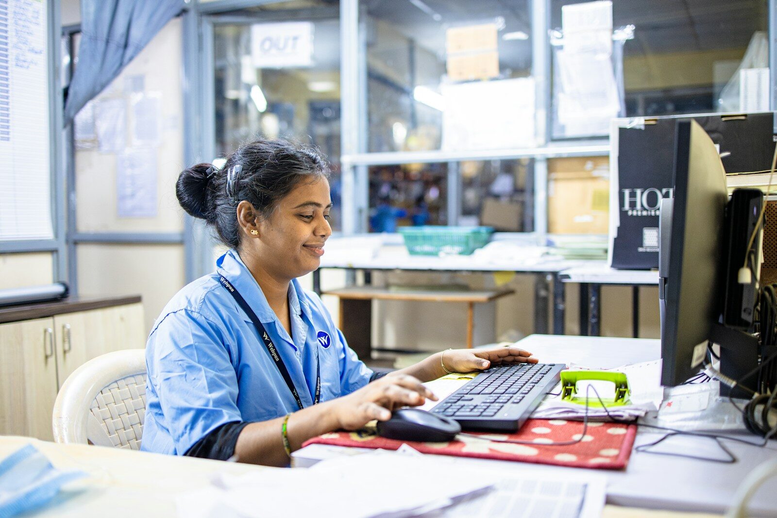 Woman works on a computer in an office