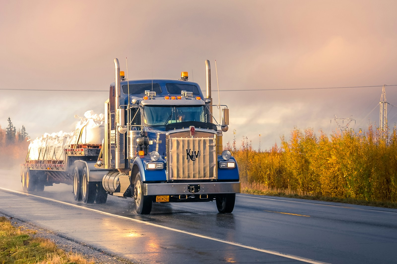 A truck driver in the cab of a big rig, representing the future of truck driving careers