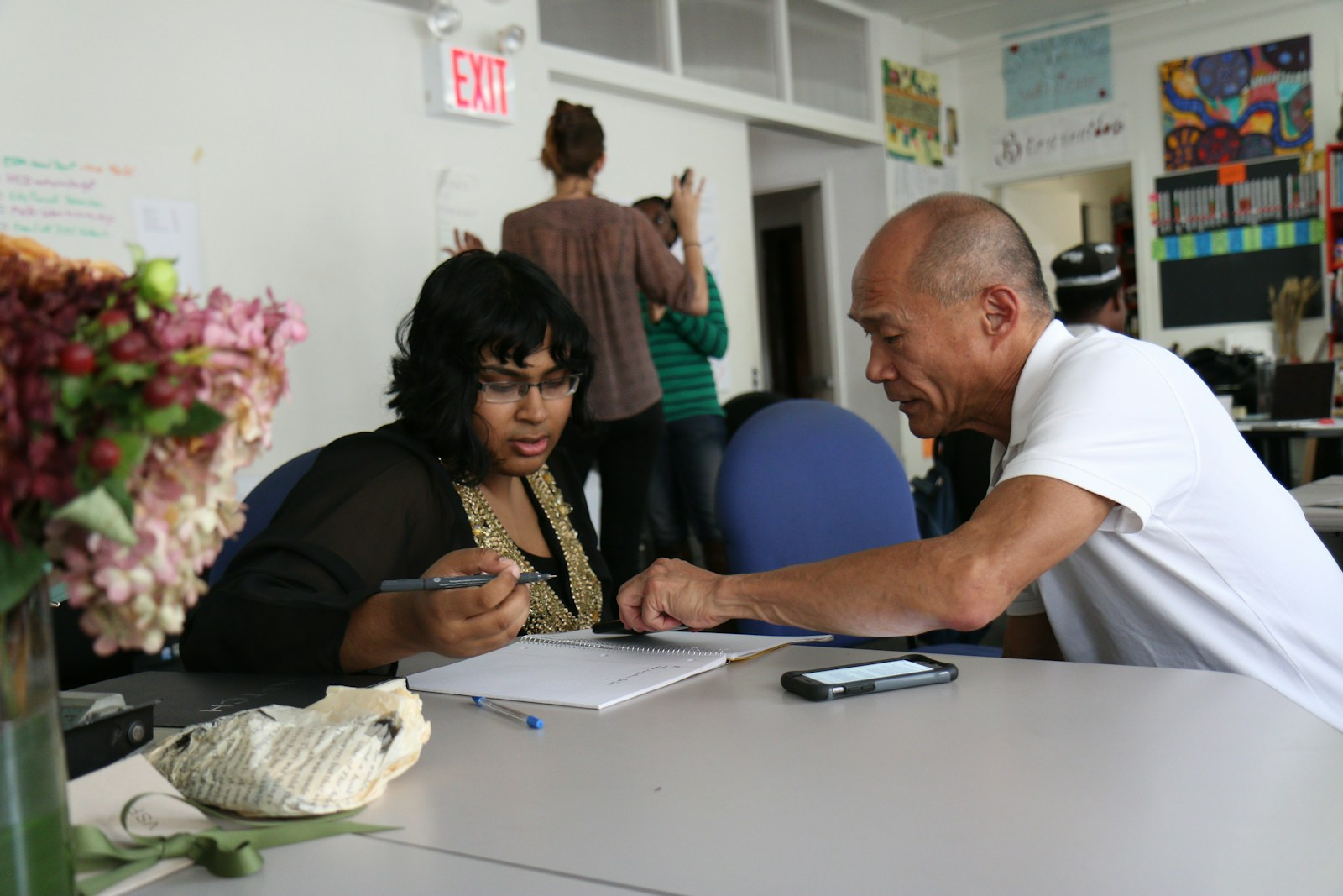 A retiree volunteering and mentoring, representing purpose and meaning in retirement