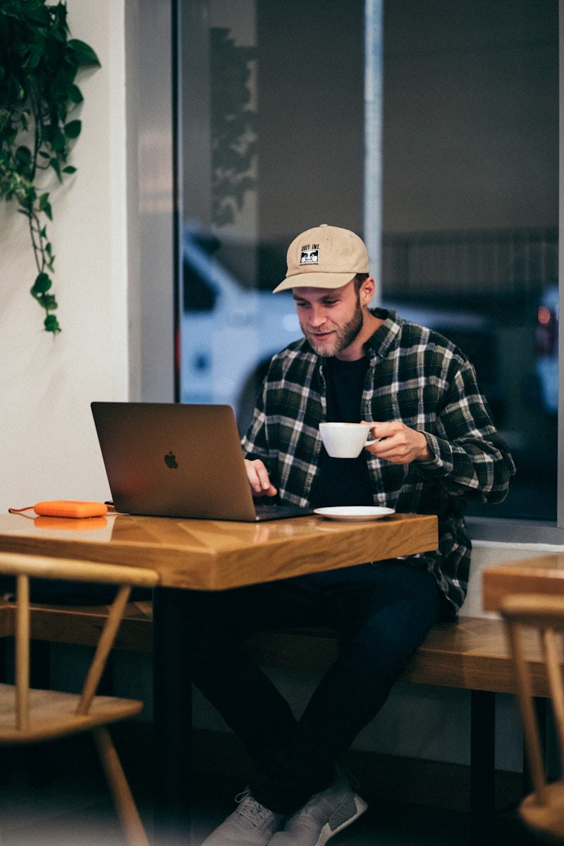 A freelancer working on a laptop, part of learning the basics of freelance jobs