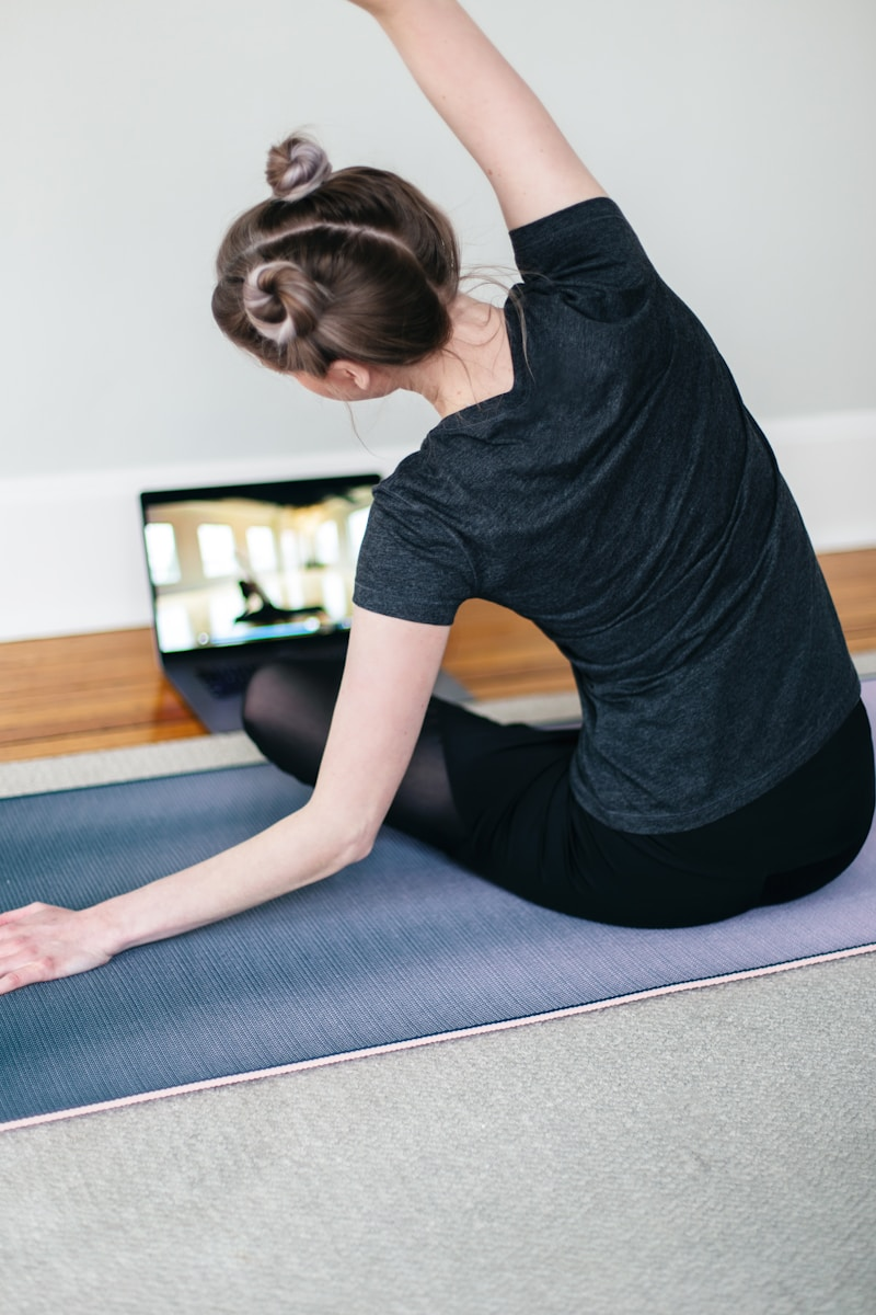 A fitness coach leading a virtual training session on a laptop, illustrating the top 4 ways to build your personal training business