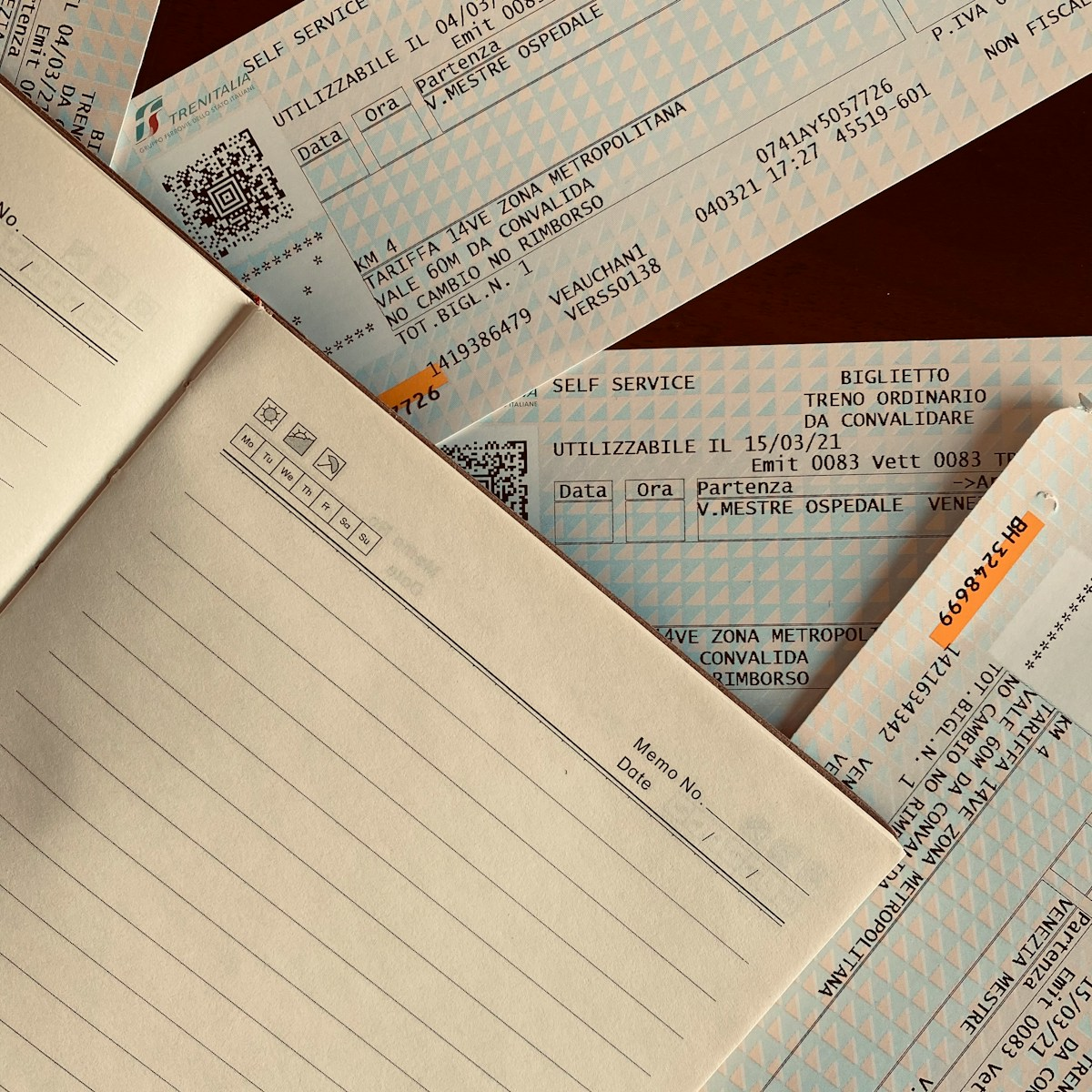 A checkbook and financial paperwork, illustrating a job scam warning about fake checks
