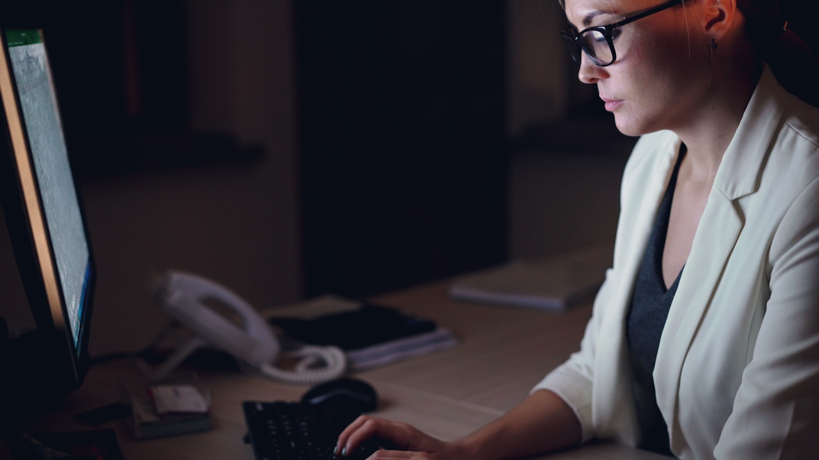 A recruiter reviewing a candidate profile on a computer screen, illustrating the power of an online resume