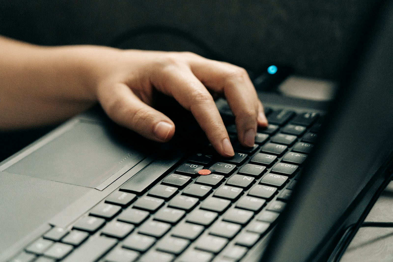 A transcriptionist typing at a computer, part of what radiology transcription jobs involve day to day