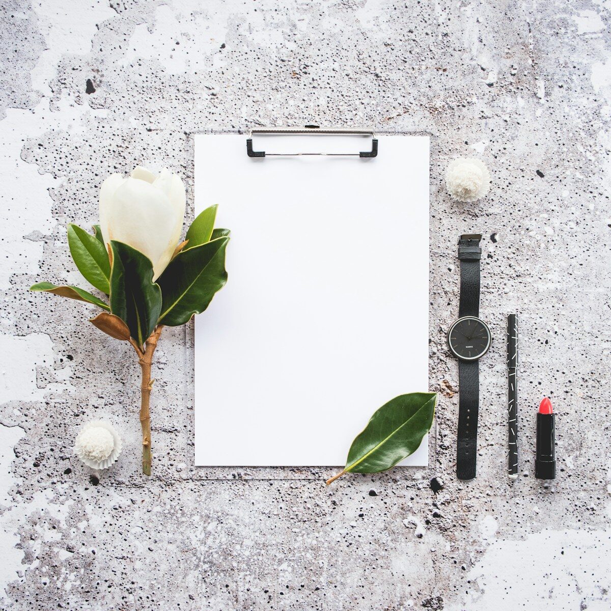 A blank checklist clipboard on a desk, representing the section headings and structure that ATS resume formatting depends on