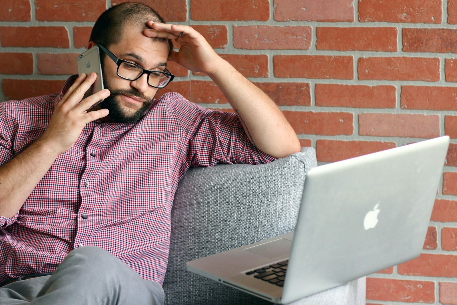A stressed job seeker looking at a laptop, illustrating the problem with Monster Jobs